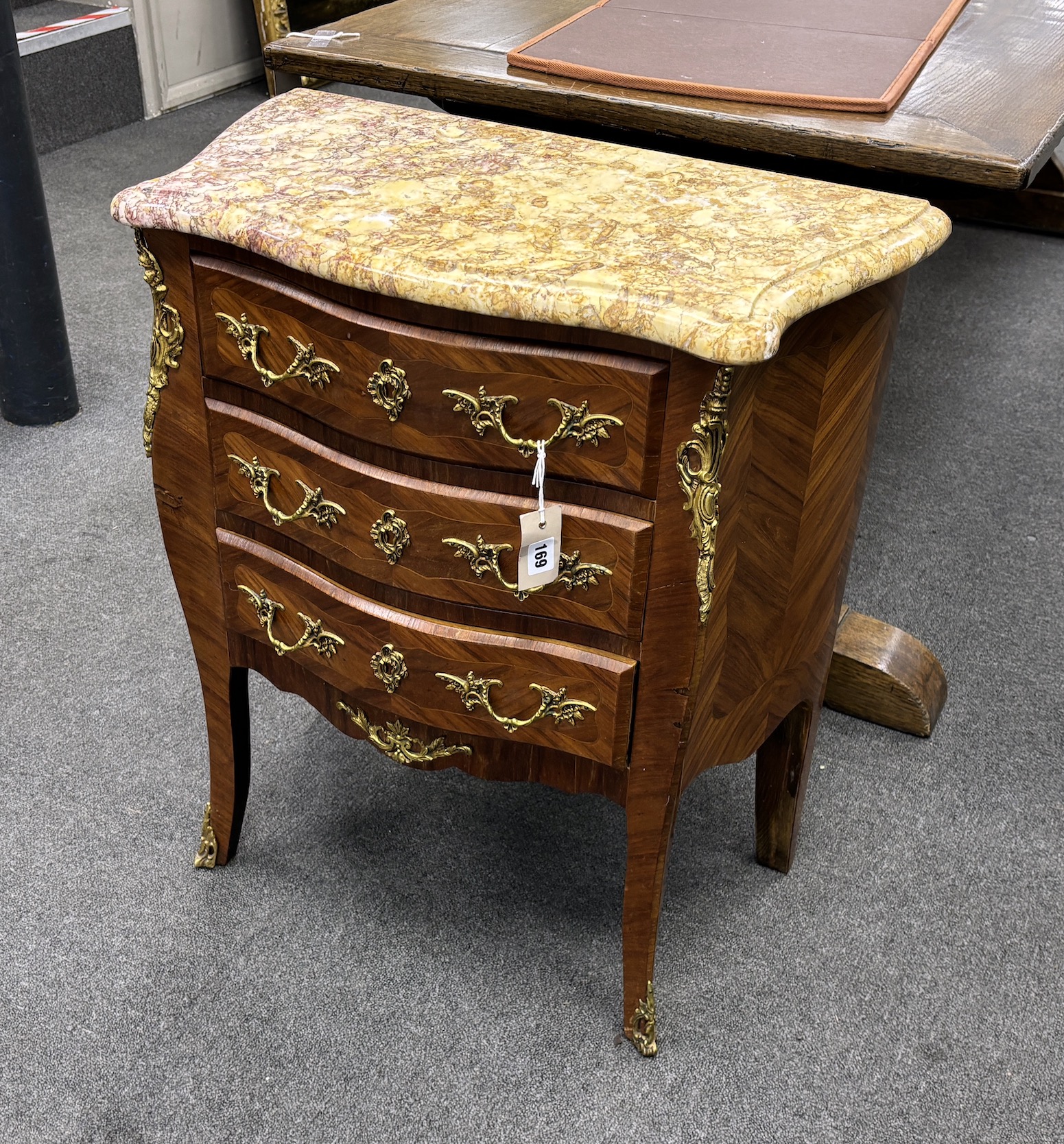 A Louis XV style gilt metal mounted marble topped serpentine petite commode, width 65cm, depth 34cm, height 74cm